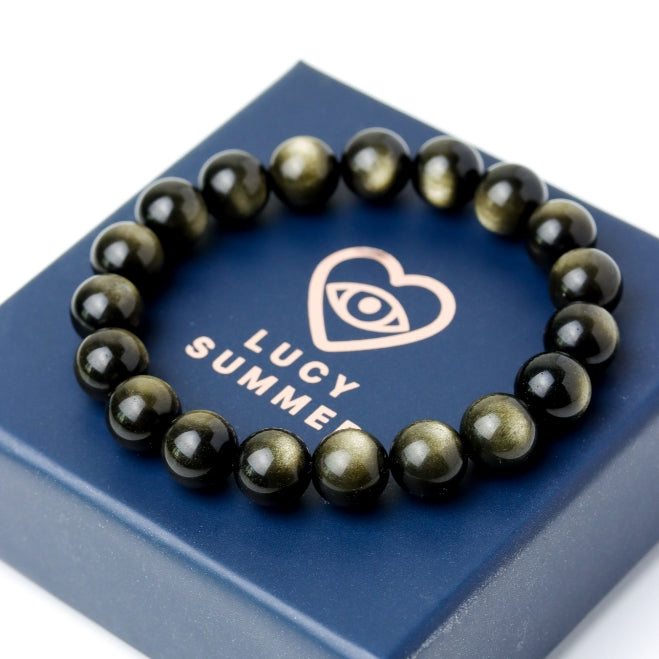 LUCY SUMMER กำไลข้อมือหินแท้ Golden Obsidian ขนาด 10 มม - ออบซิเดียน เหลือบทอง (กำไลหินแท้ รับประกันหินแท้)