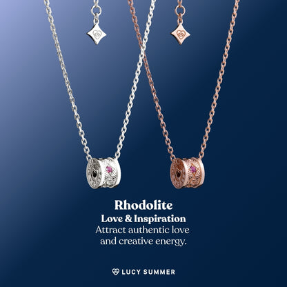 LunaOne-Mini-Rhodolite Two necklaces with gemstones on a blue background, featuring the brand 'Lucy Summer'.