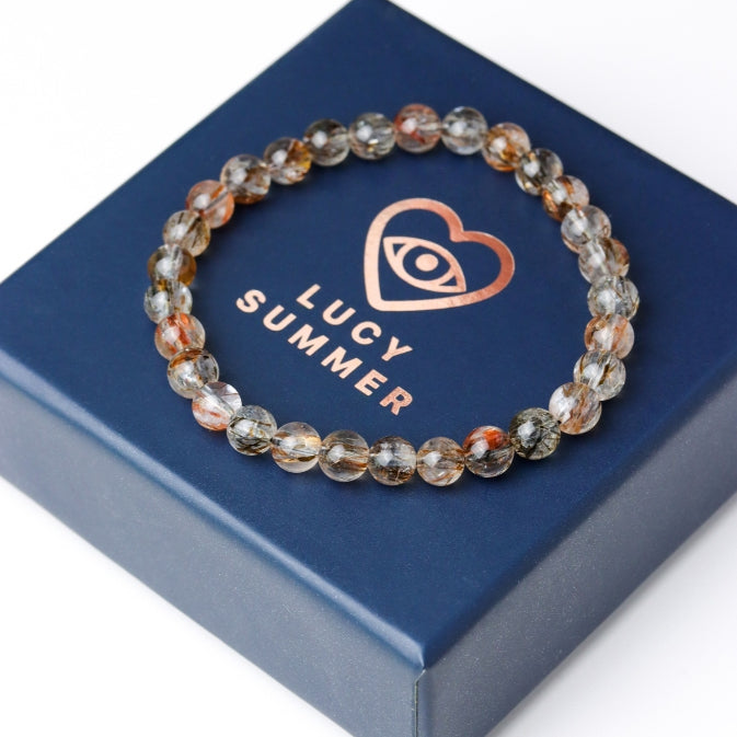 LUCY SUMMER กำไลข้อมือหินแท้ Black Gold Super Seven Rutile Quartz แบล็คโกลด์ซุปเปอร์เซเว่น ขนาด 7 mm.