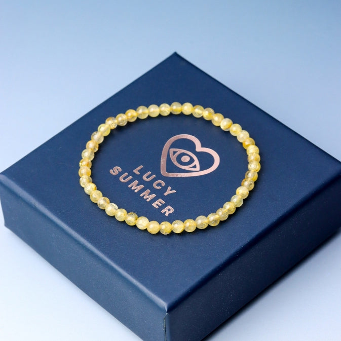 LUCY SUMMER กำไลข้อมือทหินแท้ ไหมทอง (Rutilated Quartz) ขนาด 4 มม.