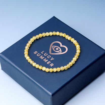 LUCY SUMMER กำไลข้อมือทหินแท้ ไหมทอง (Rutilated Quartz) ขนาด 4 มม.