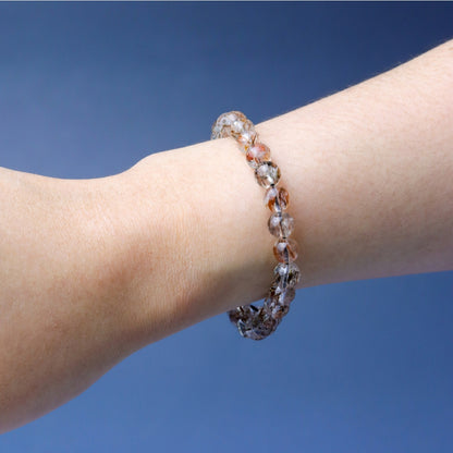 LUCY SUMMER กำไลข้อมือหินแท้ Black Gold Super Seven Rutile Quartz แบล็คโกลด์ซุปเปอร์เซเว่น ขนาด 7 mm.