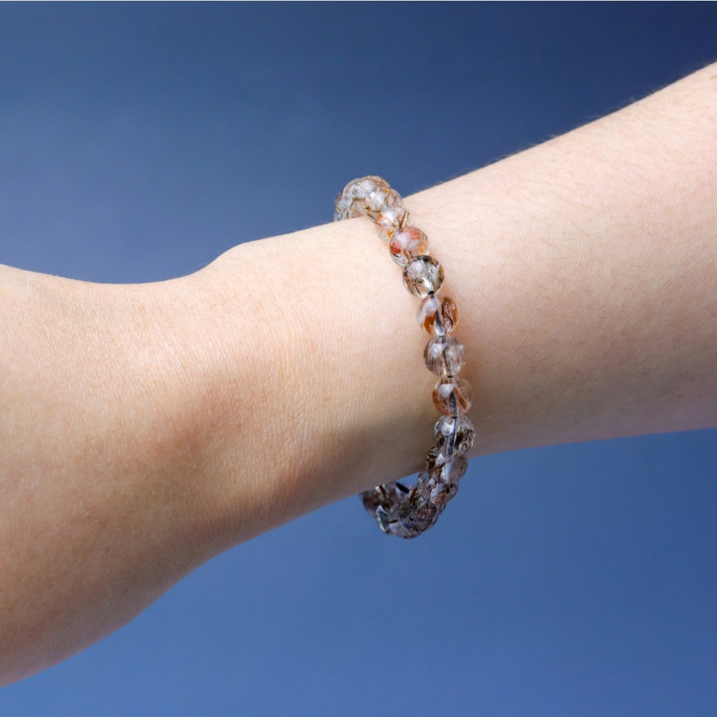 LUCY SUMMER กำไลข้อมือหินแท้ Black Gold Super Seven Rutile Quartz แบล็คโกลด์ซุปเปอร์เซเว่น ขนาด 7 mm.