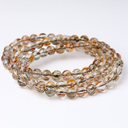 LUCY SUMMER กำไลข้อมือหินแท้ Black Gold Super Seven Rutile Quartz แบล็คโกลด์ซุปเปอร์เซเว่น ขนาด 7 mm.