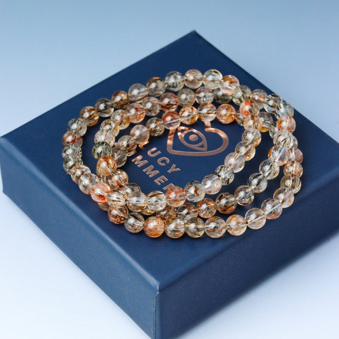 LUCY SUMMER กำไลข้อมือหินแท้ Black Gold Super Seven Rutile Quartz แบล็คโกลด์ซุปเปอร์เซเว่น ขนาด 7 mm.