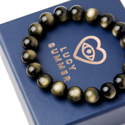 LUCY SUMMER กำไลข้อมือหินแท้ Golden Obsidian ขนาด 10 มม  - ออบซิเดียน เหลือบทอง (กำไลหินแท้ รับประกันหินแท้)